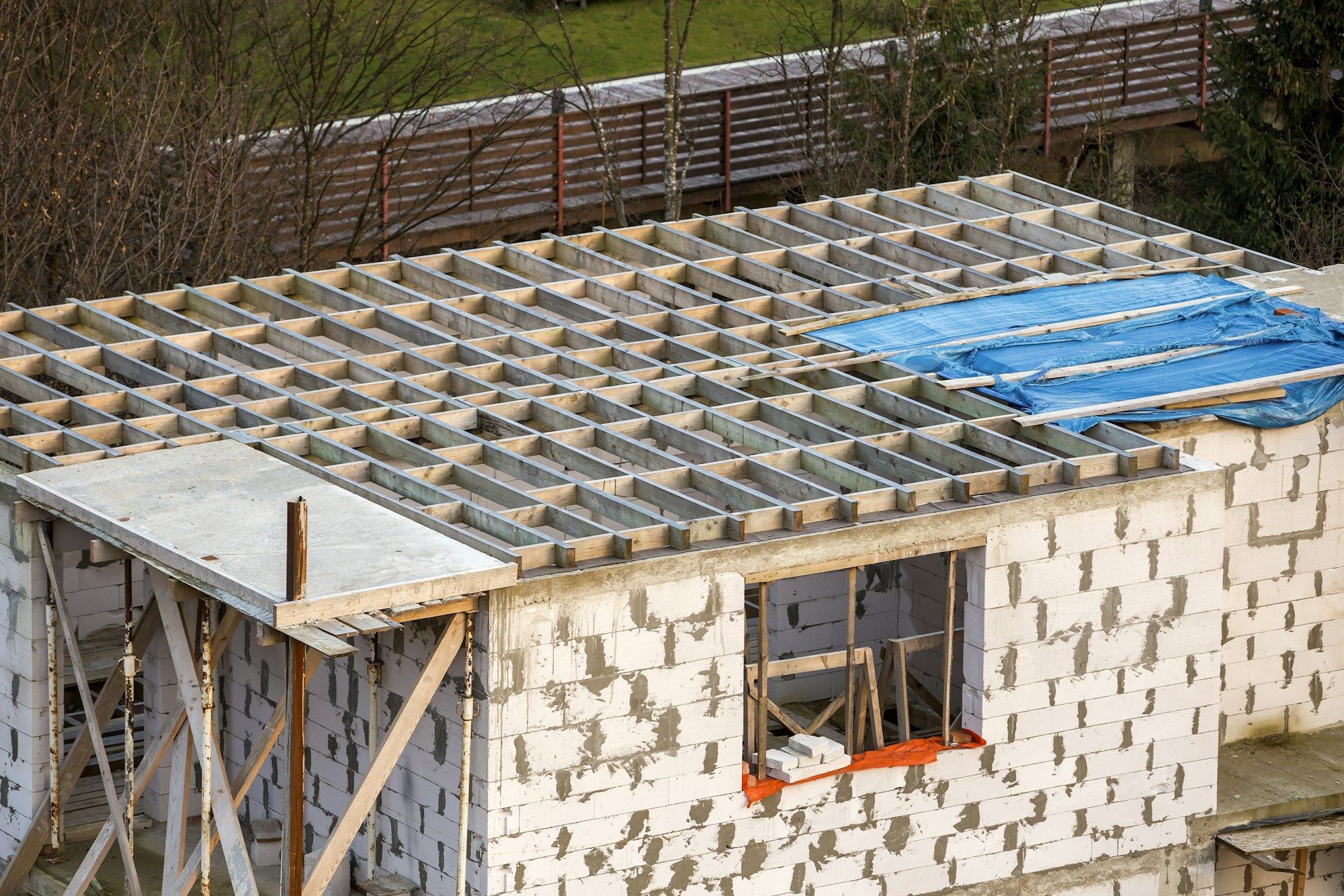 Building under construction. Roof beams frame and roofing underlayment, water-resistant waterproof